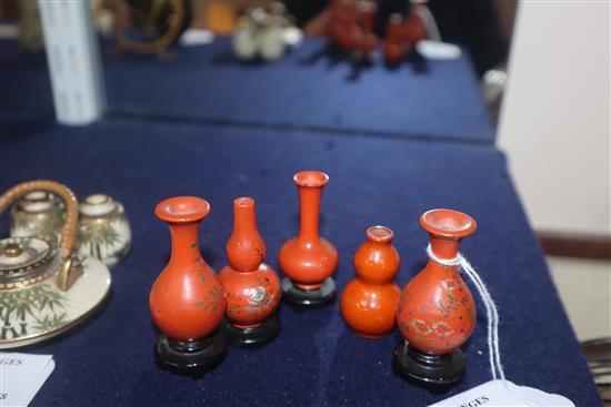 A group of four Chinese lacquer wood miniature vases and a similar pottery double gourd vase (5)